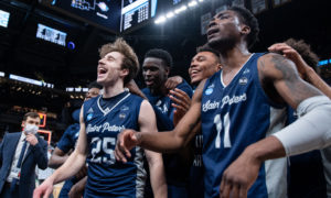 St. Peter's Peacocks basketball players celebrating after an NCAA Tournament win against Murray State